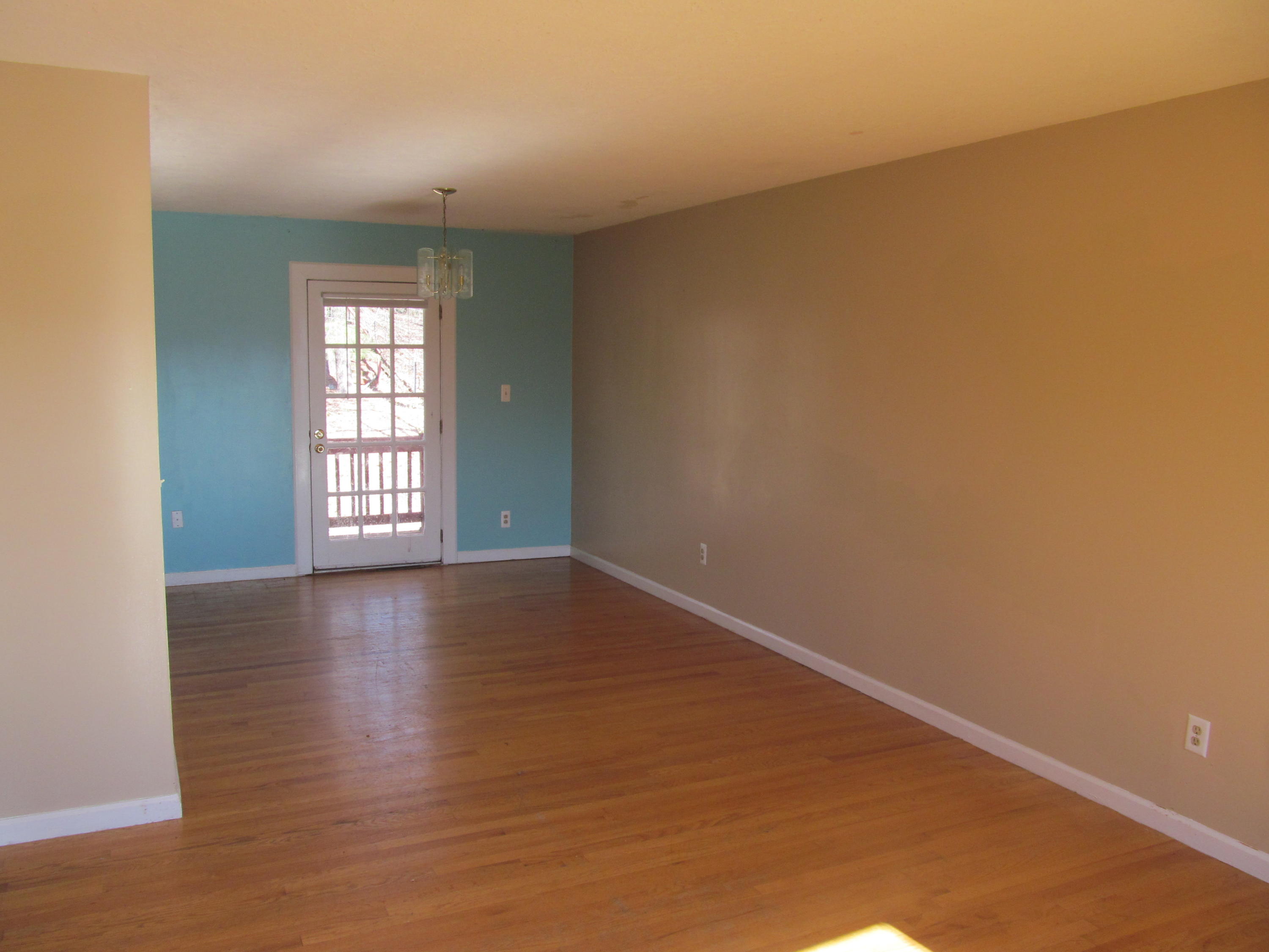 624 Ramada Road Vinton, VA 24179 - Photo 4 of 25 an empty room with wooden floor and windows