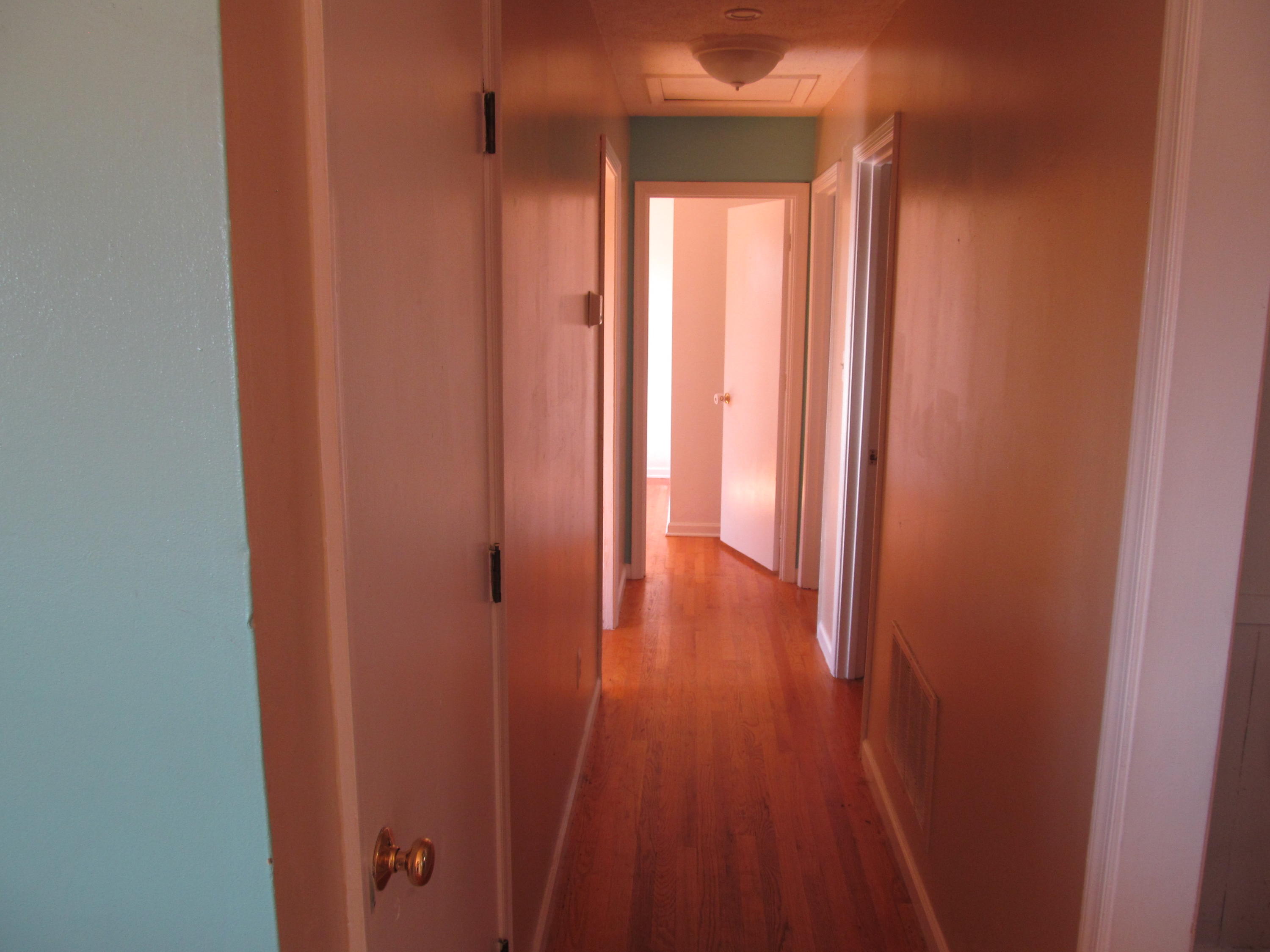 624 Ramada Road Vinton, VA 24179 - Photo 6 of 25 a view of a hallway with wooden floor