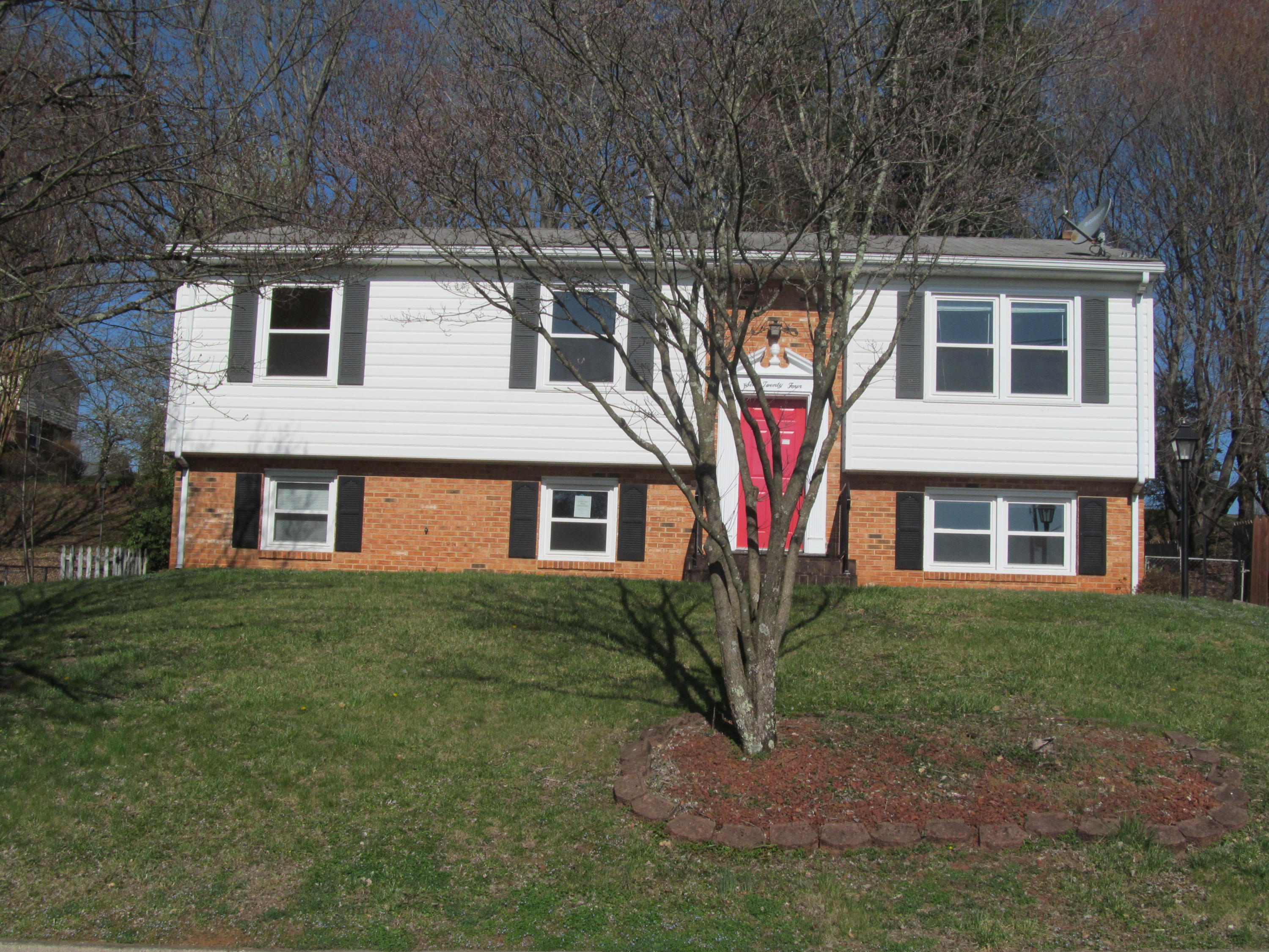 624 Ramada Road Vinton, VA 24179 - Photo 8 of 25 a front view of a house with a garden and trees