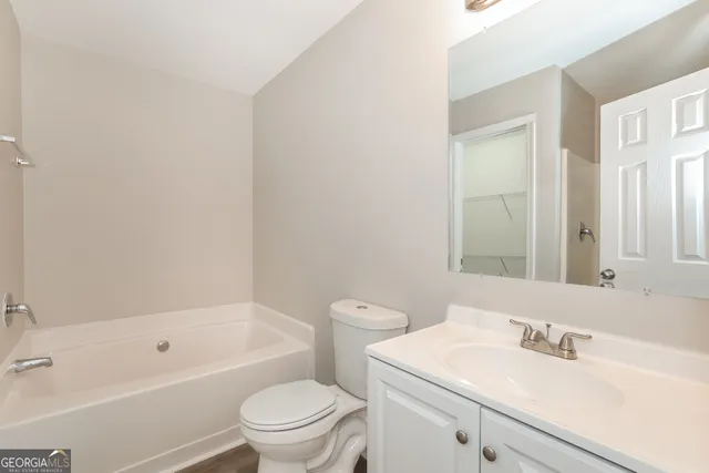 a bathroom with a sink a toilet and a bathtub