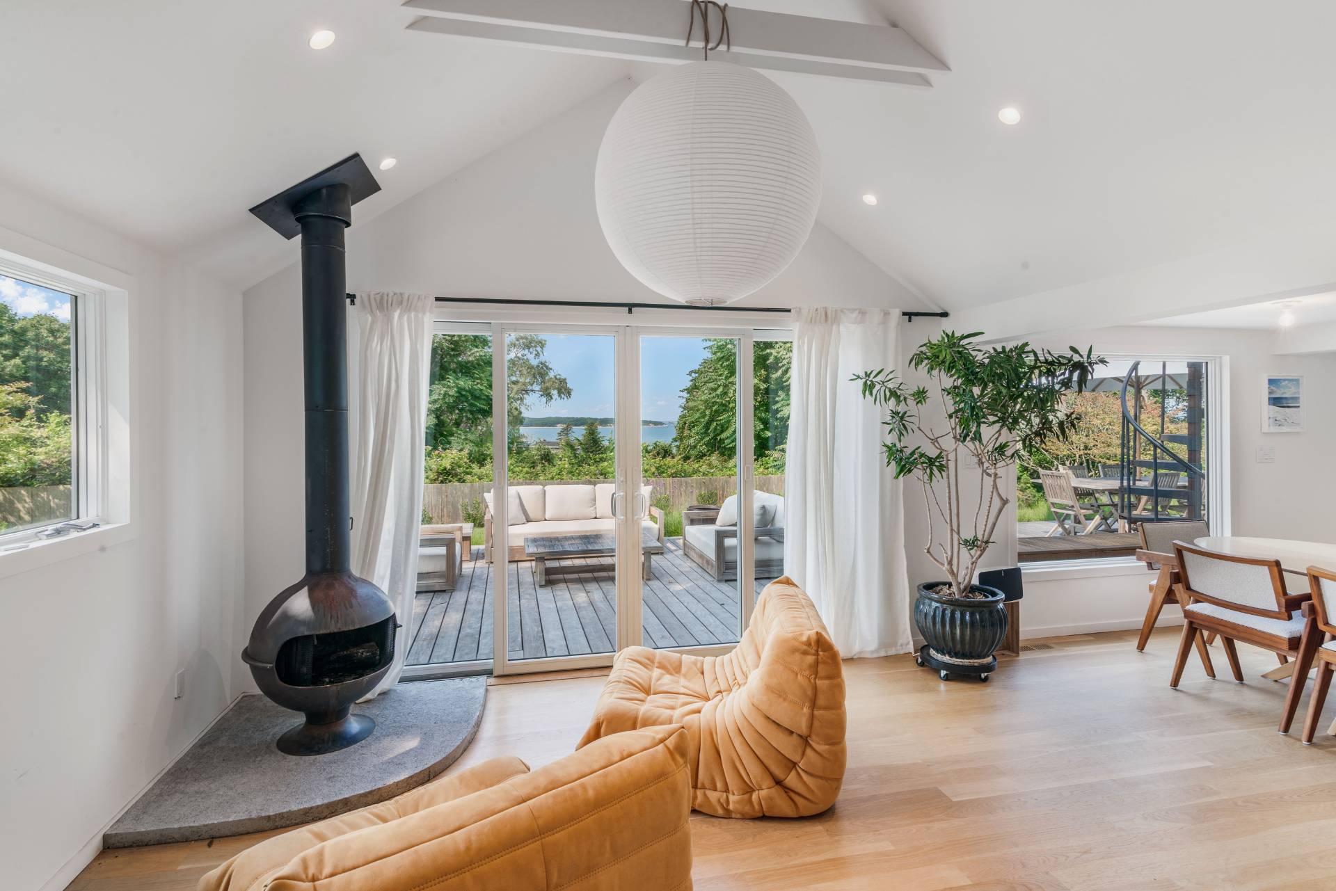58 Fleming Road Montauk, NY 11954 - Photo 11 of 35 a living room with furniture and a floor to ceiling window