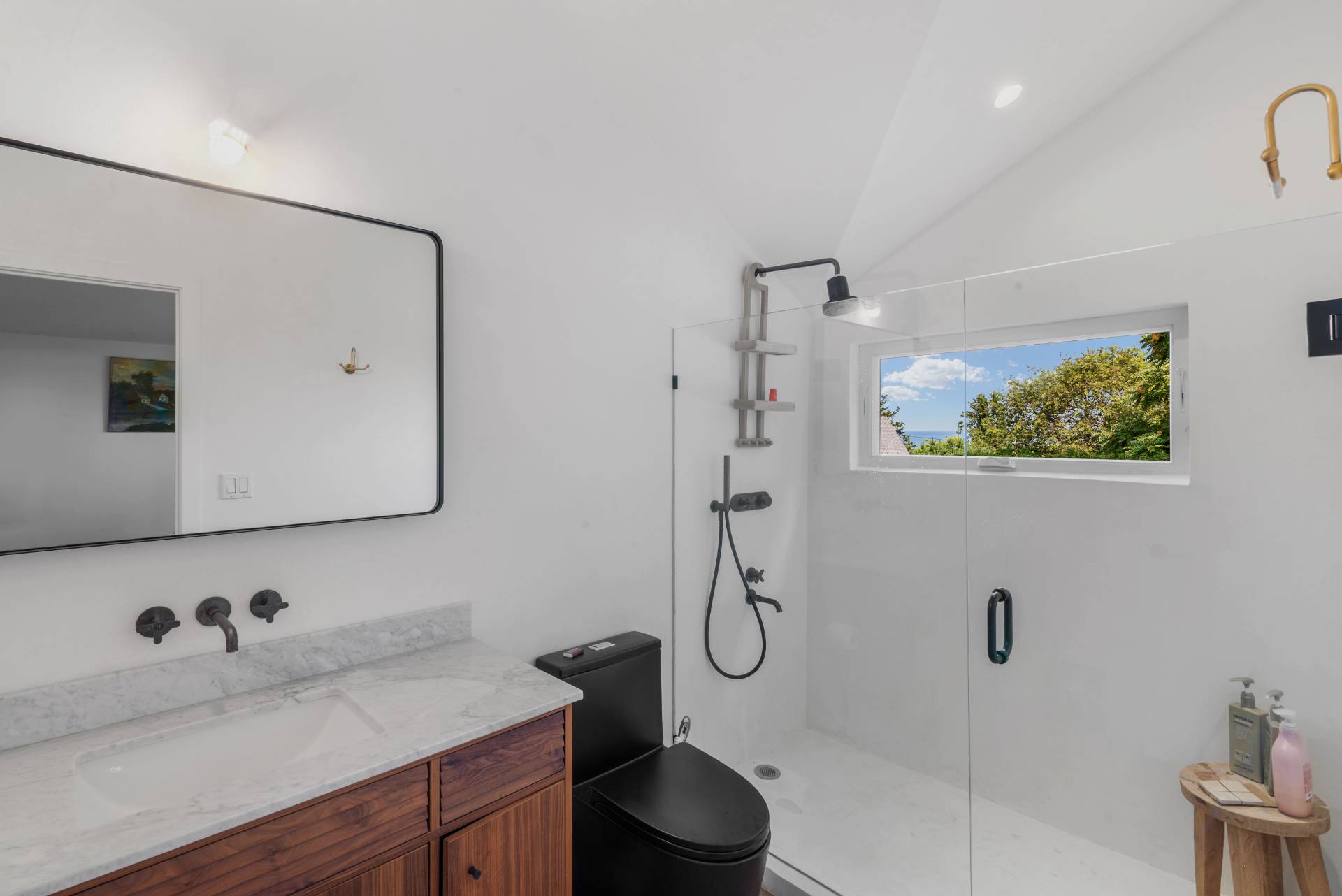58 Fleming Road Montauk, NY 11954 - Photo 16 of 35 a bathroom with a granite countertop sink mirror vanity and toilet