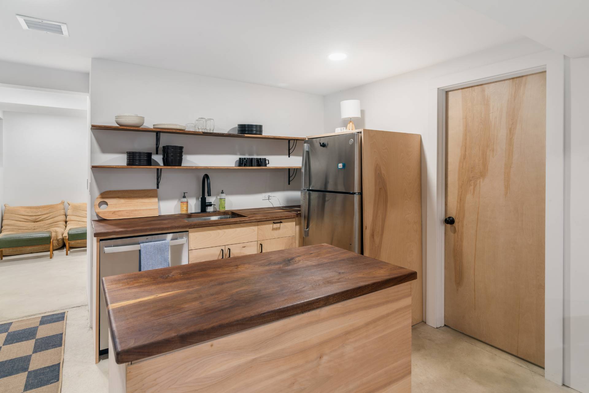 58 Fleming Road Montauk, NY 11954 - Photo 17 of 35 a kitchen with kitchen island cabinets and refrigerator