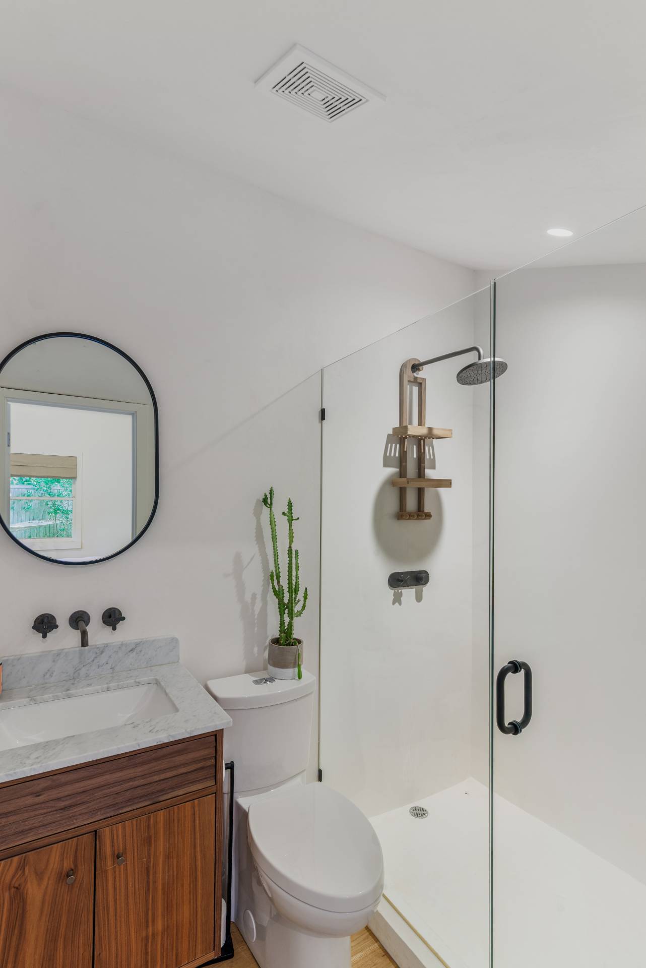 58 Fleming Road Montauk, NY 11954 - Photo 18 of 35 a bathroom with a granite countertop sink a toilet and shower
