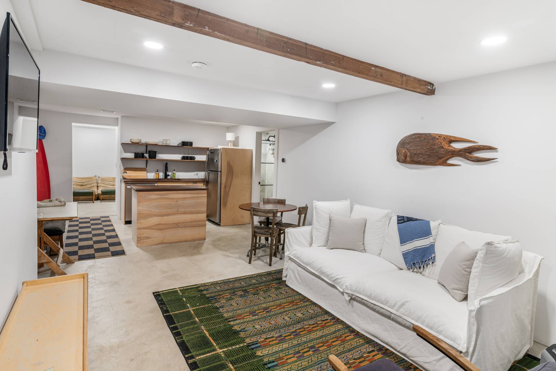 58 Fleming Road Montauk, NY 11954 - Photo 19 of 35 a living room with furniture and a rug