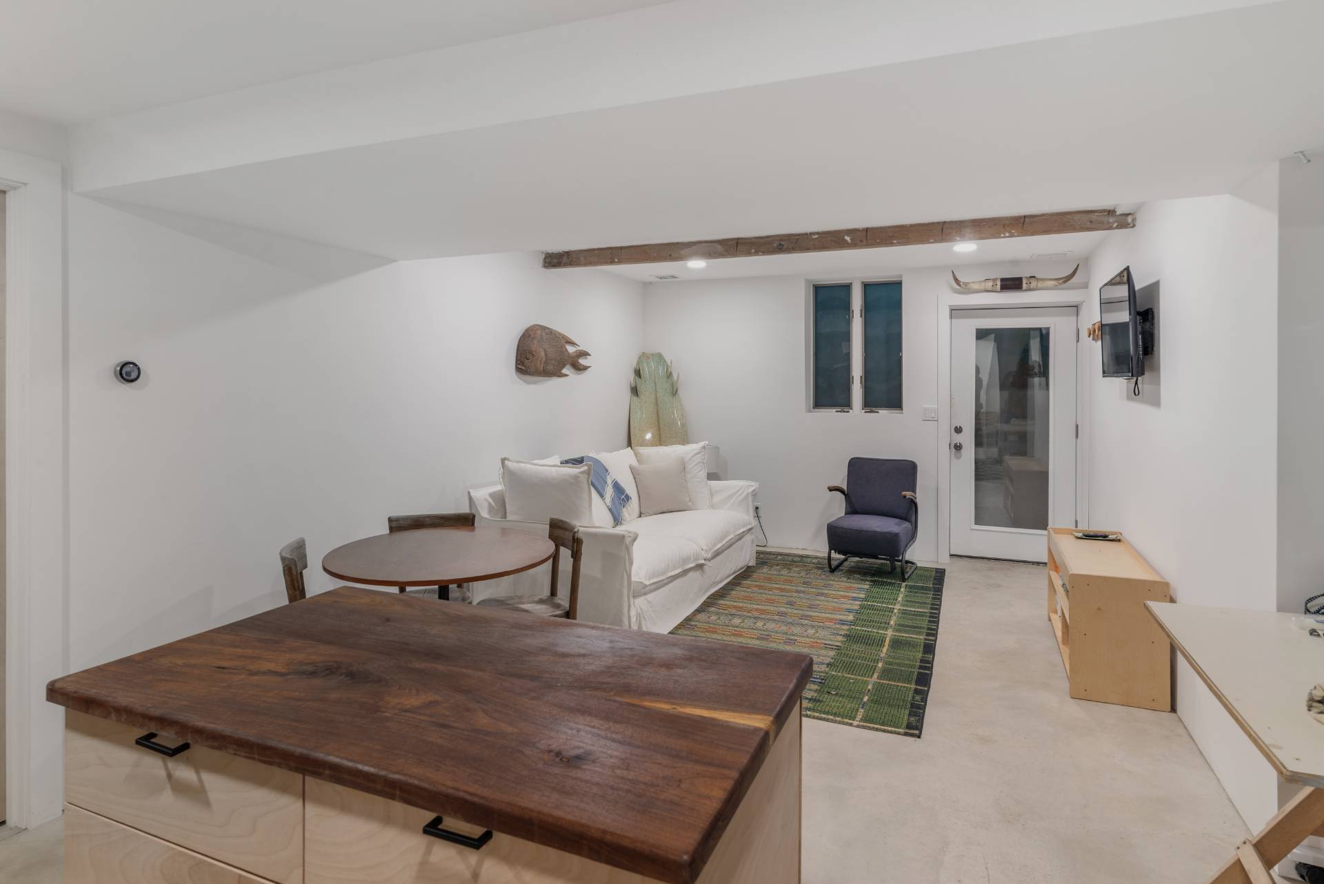 58 Fleming Road Montauk, NY 11954 - Photo 21 of 35 a living room with furniture and a table