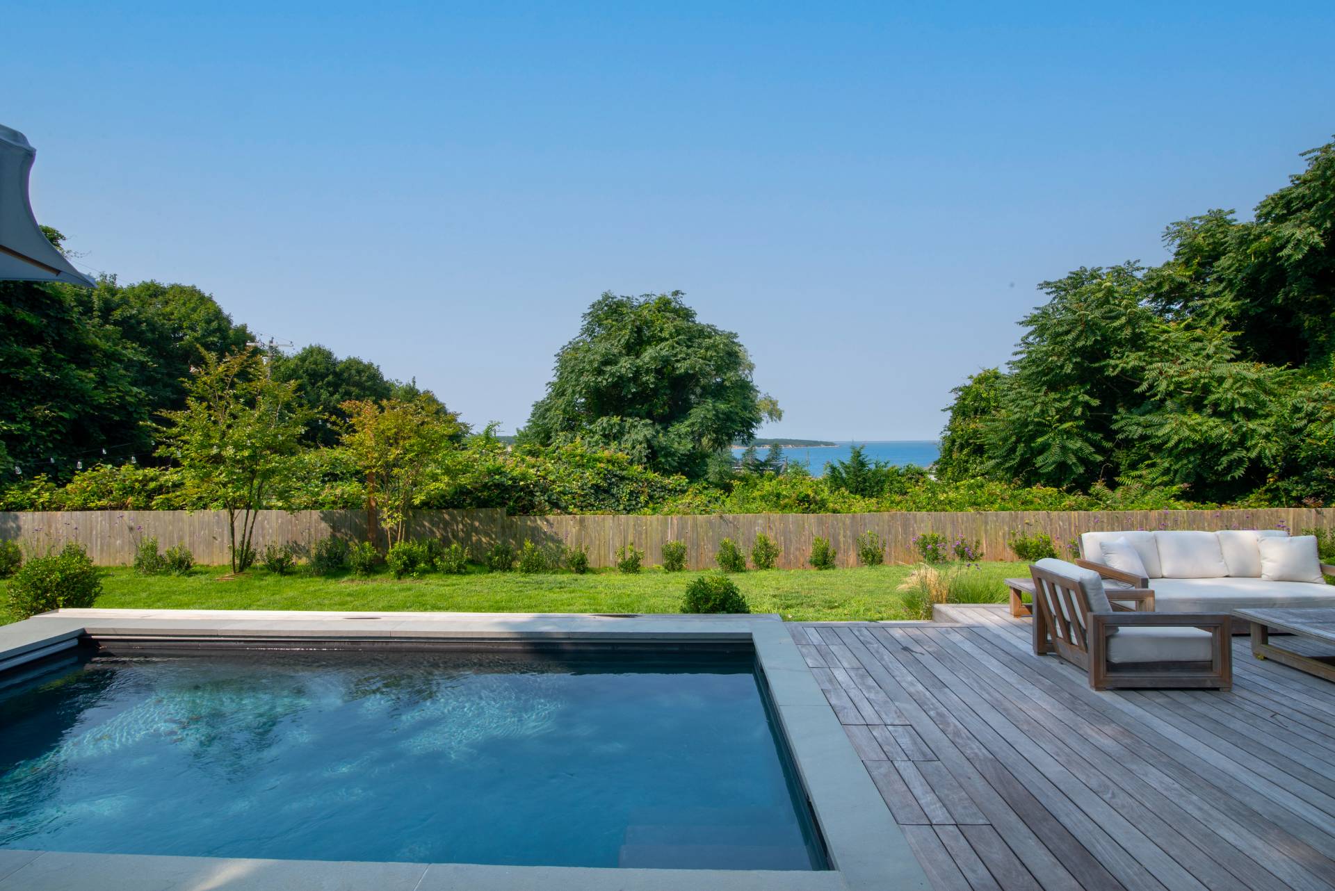 58 Fleming Road Montauk, NY 11954 - Photo 27 of 35 a view of yard with seating area and trees around