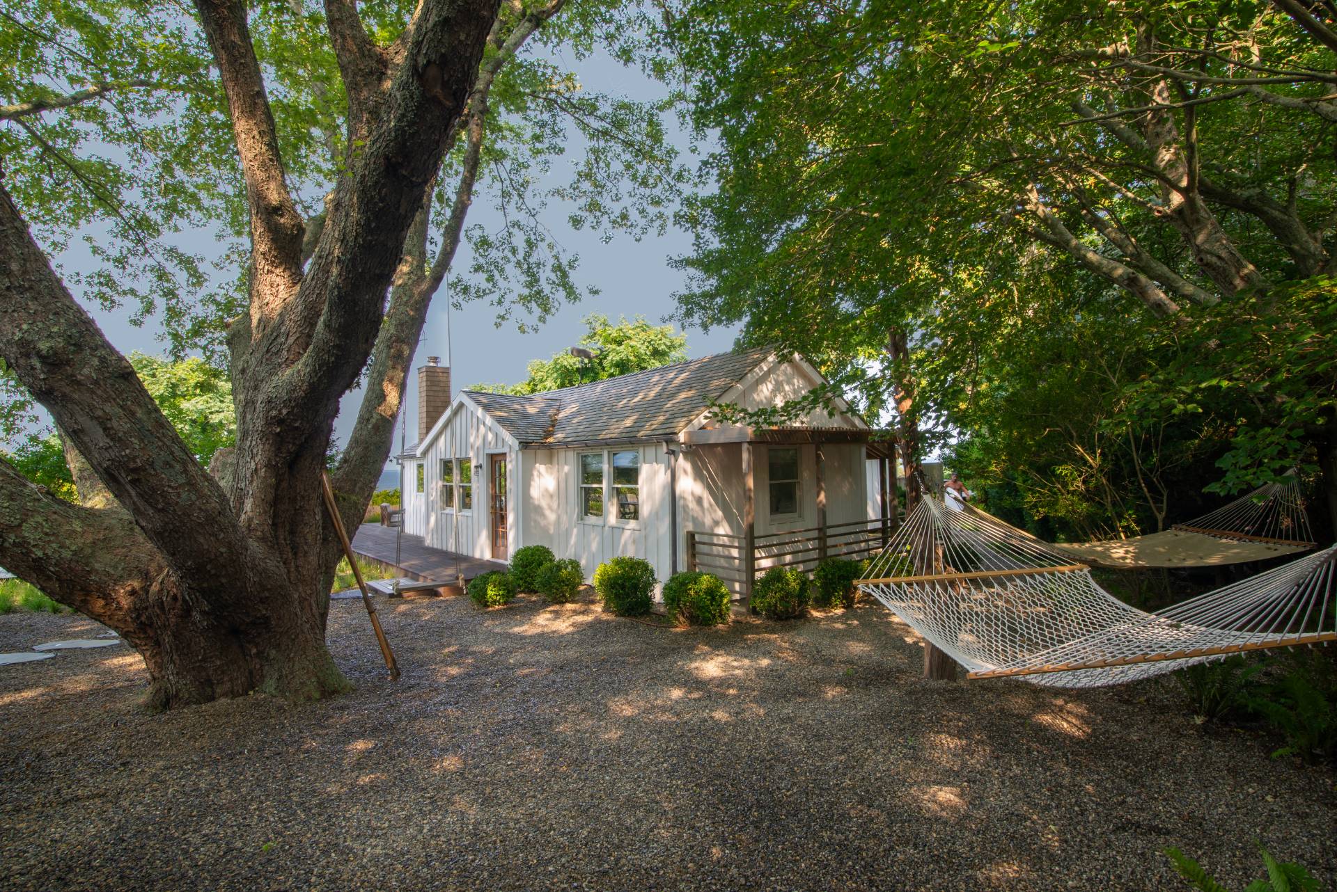 58 Fleming Road Montauk, NY 11954 - Photo 30 of 35 a view of a house with a tree in front of it
