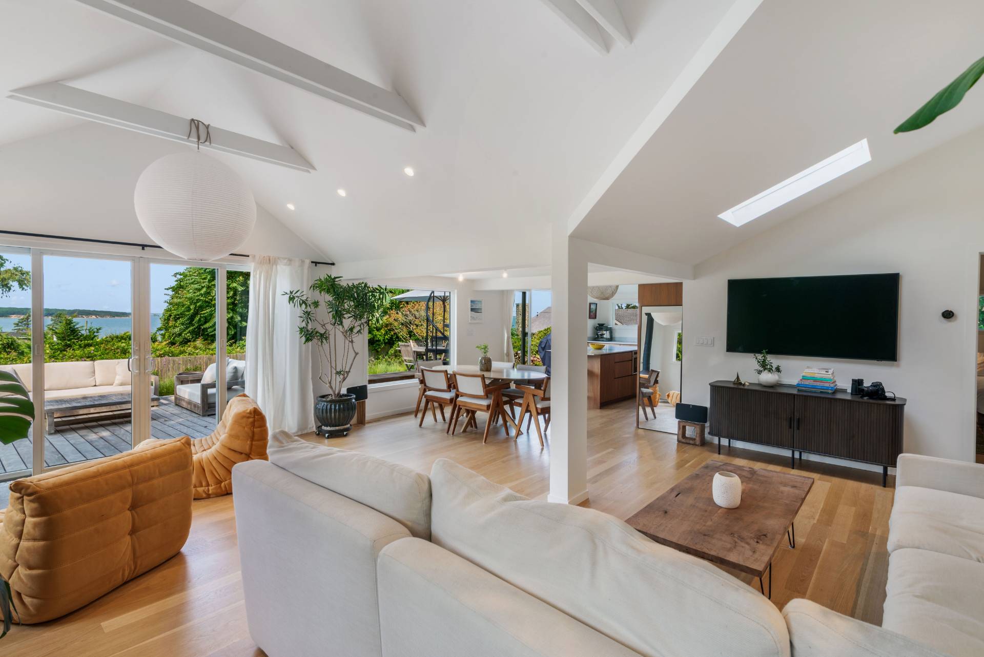 58 Fleming Road Montauk, NY 11954 - Photo 5 of 35 a living room with furniture and a flat screen tv