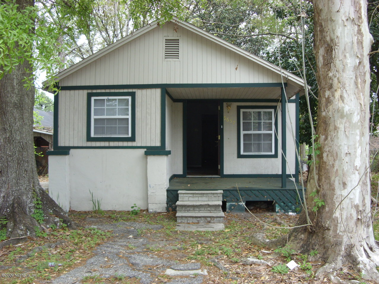 5657 Spellman Road Jacksonville, FL 32209 - Photo 1 of 5 a view of a house with a yard