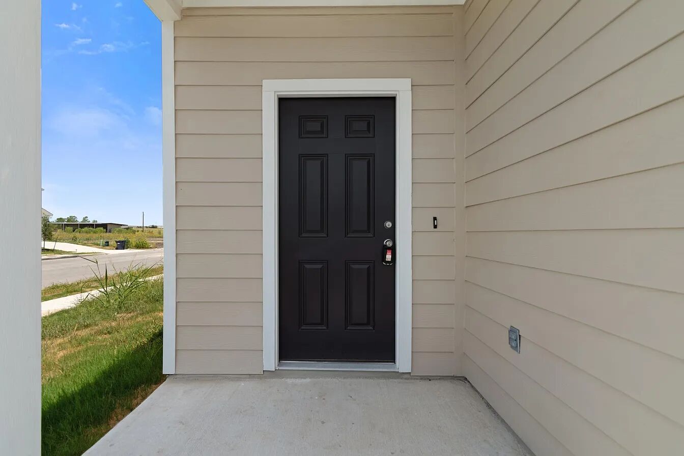 101 Aoudad Road Hutto, TX 78634 - Photo 6 of 39 A welcoming entry, with durable siding, hints at a well-maintained property.