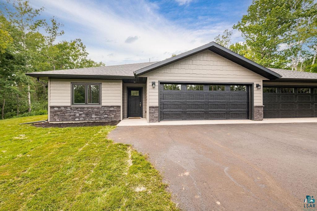 3971 Haines Road Hermantown, MN 55811 - Photo 3 of 34 Exterior featuring stone veneer and horizontal siding accents