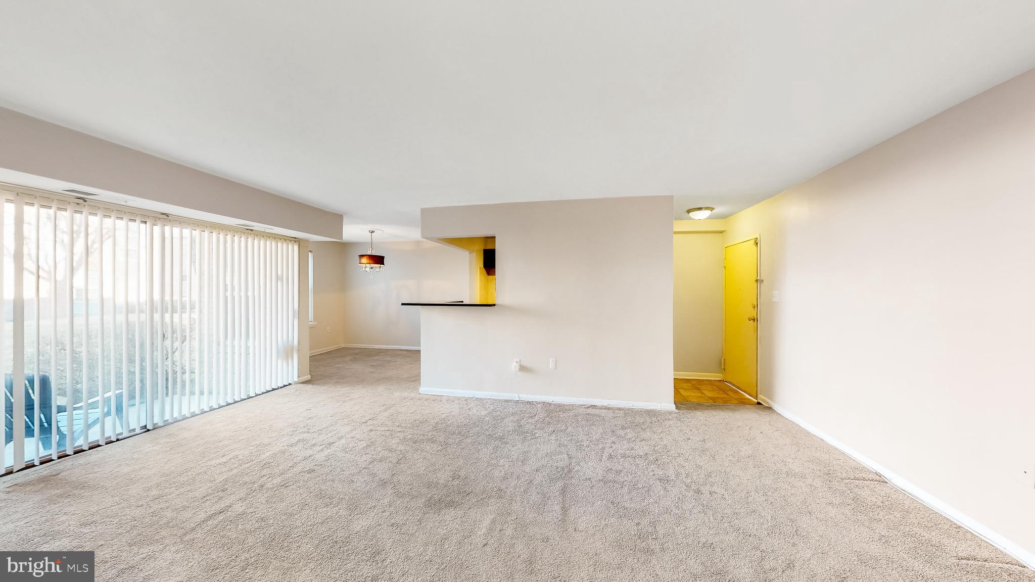 3861 St Barnabas Road, Unit T2 Suitland, MD 20746 - Photo 14 of 17 Living room view to the kitchen and dining