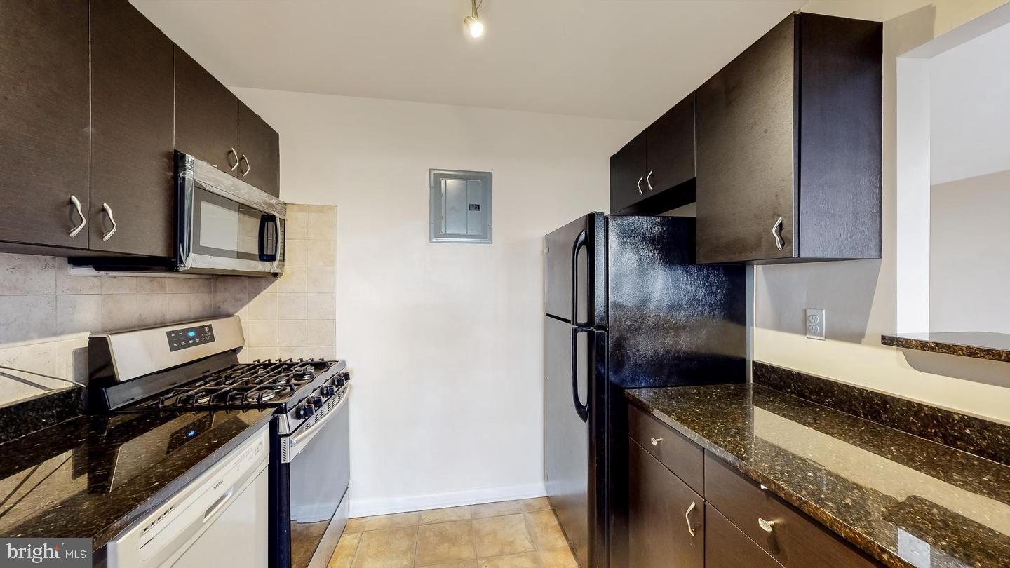 3861 St Barnabas Road, Unit T2 Suitland, MD 20746 - Photo 4 of 17 Galley style kitchen with stone counters!!