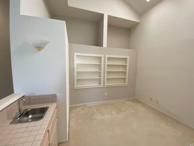 a bathroom with a sink a vanity and window