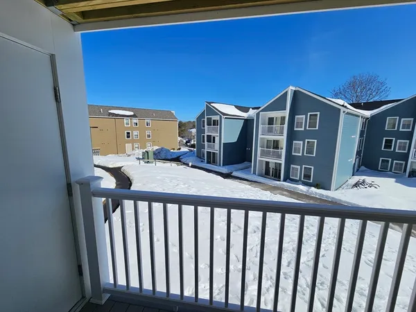 a view of a brick building from a balcony