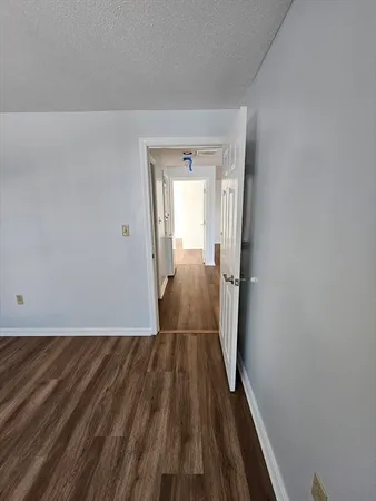 a view of a room with wooden floor and staircase
