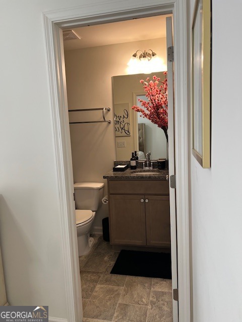 832 Ambient Way Atlanta, GA 30331 - Photo 24 of 32 a bathroom with a toilet sink and vanity