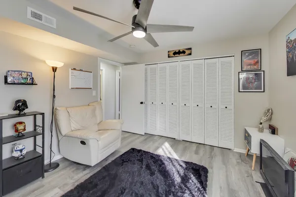 a spacious bedroom with a bed and a window