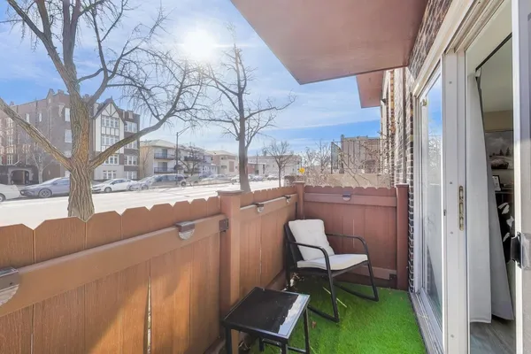 a room with pool table and a wooden floor