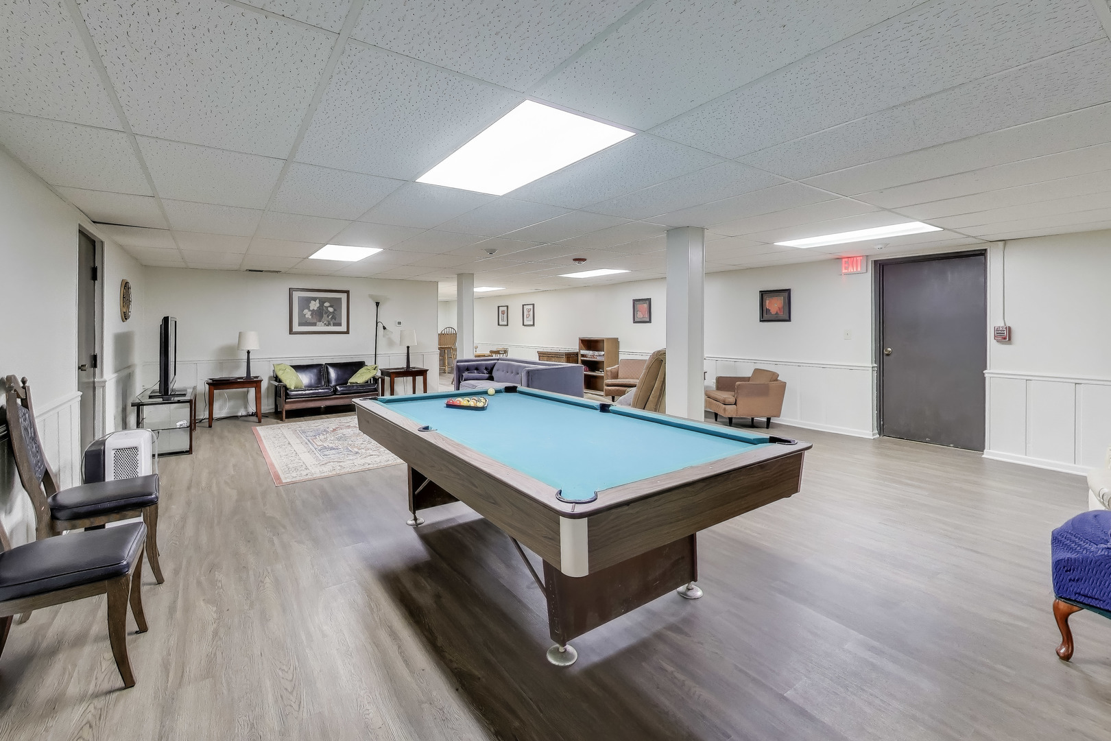 475 Shenstone Road, Unit 104 Riverside, IL 60546 - Photo 21 of 24 a room with pool table and a wooden floor