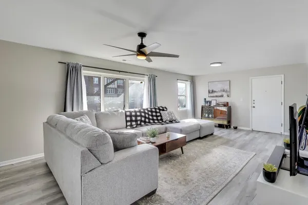a living room with furniture and a window