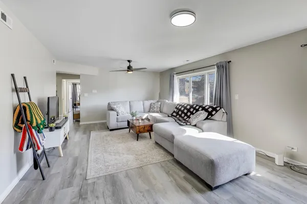 a living room with furniture and a window