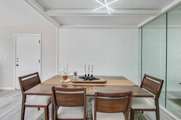 a dining room with a table and chairs