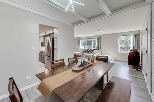 a living room with furniture potted plant and a window