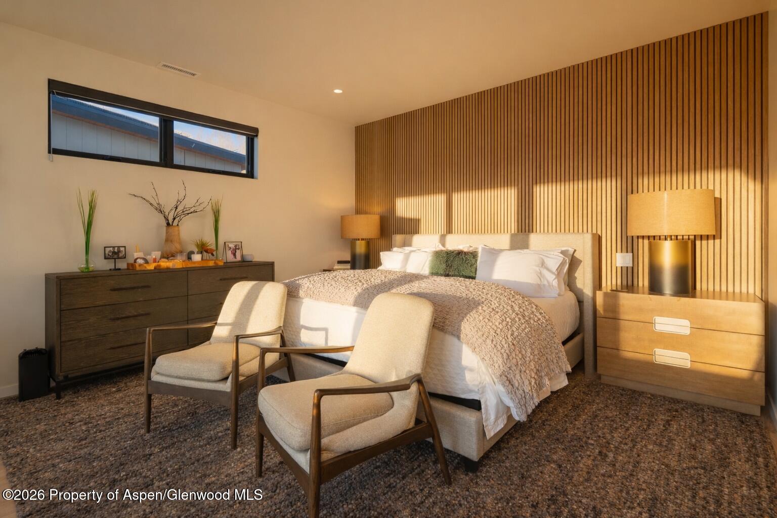 219 Juniper Court Basalt, CO 81621 - Photo 12 of 25 a bed room with a bed and a chair