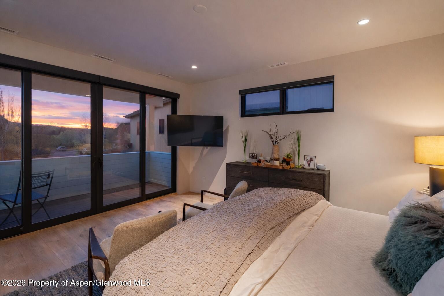 219 Juniper Court Basalt, CO 81621 - Photo 13 of 25 a bedroom with a bed and large window