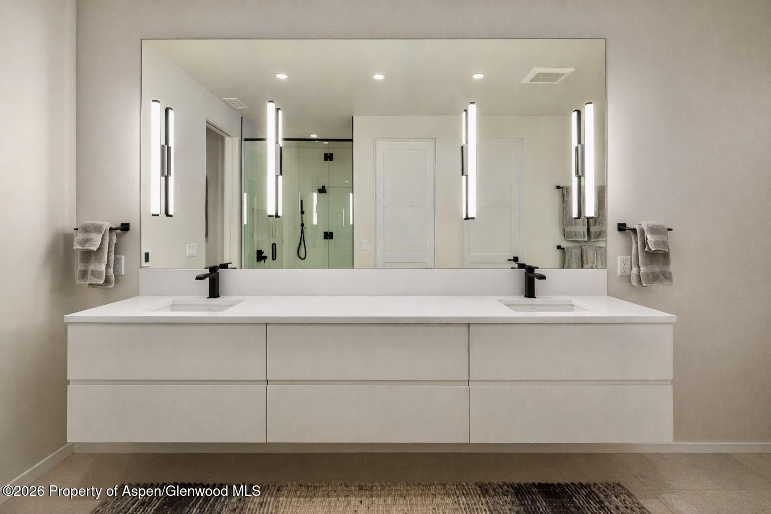 219 Juniper Court Basalt, CO 81621 - Photo 14 of 25 a bathroom with a sink vanity and mirror