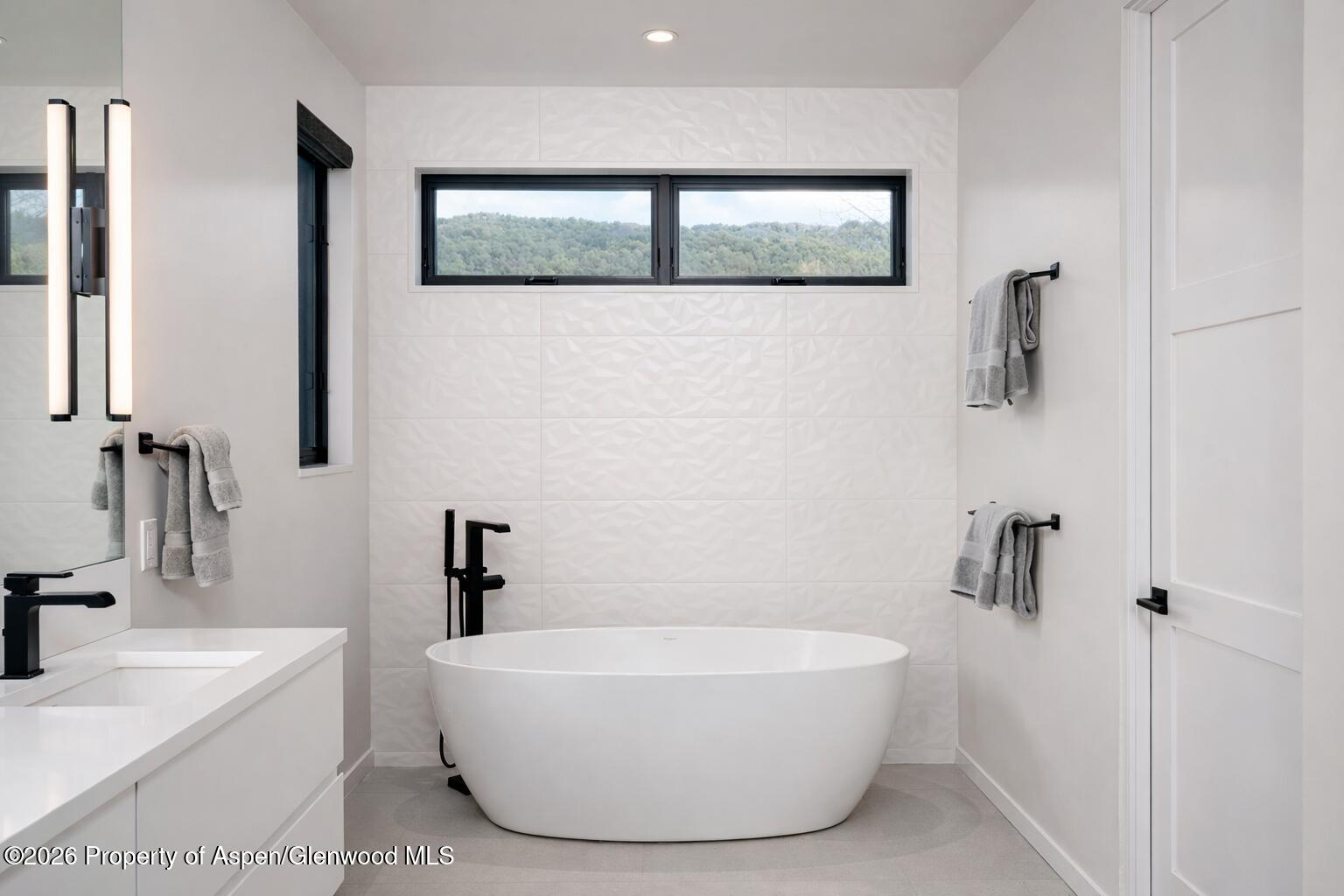 219 Juniper Court Basalt, CO 81621 - Photo 15 of 25 a bathroom with a white tub sink