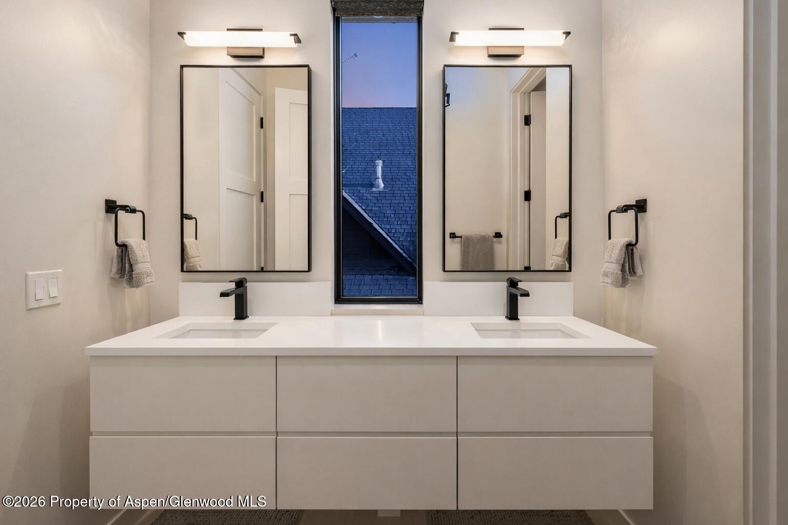 219 Juniper Court Basalt, CO 81621 - Photo 17 of 25 a bathroom with a sink vanity and a mirror