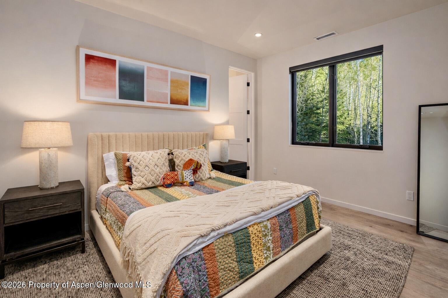 219 Juniper Court Basalt, CO 81621 - Photo 19 of 25 a bedroom with a bed and a window