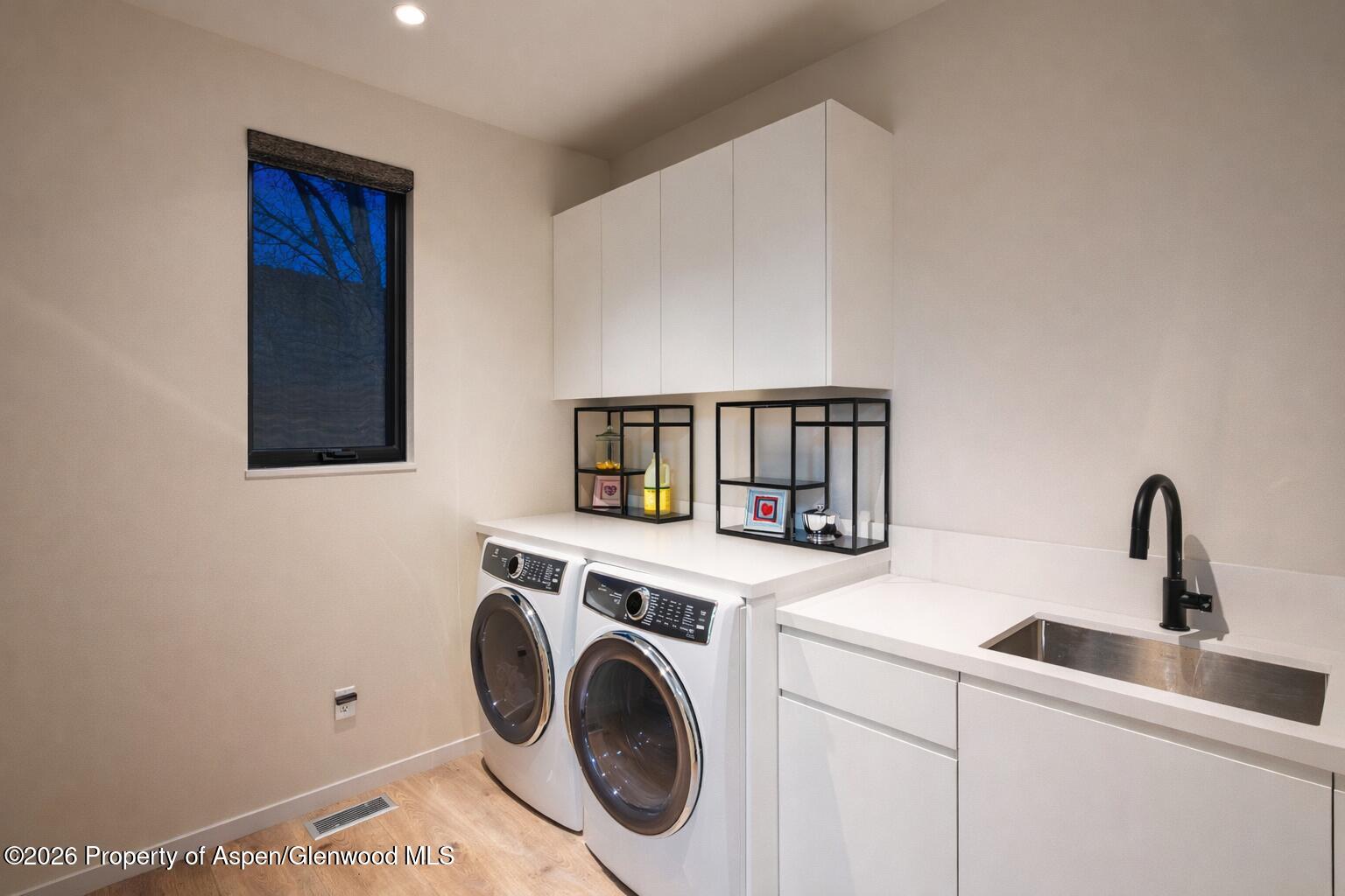 219 Juniper Court Basalt, CO 81621 - Photo 23 of 25 a utility room with sink dryer and washer