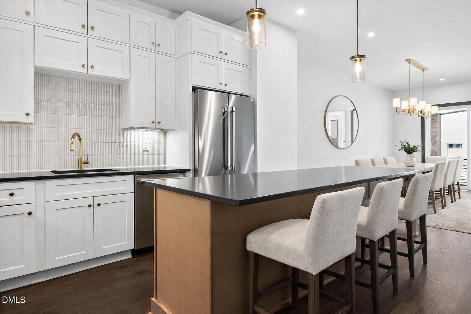 1521 1/2 Sunrise Avenue Raleigh, NC 27608 - Photo 19 of 37 a kitchen with stainless steel appliances granite countertop a sink a stove a refrigerator and cabinets