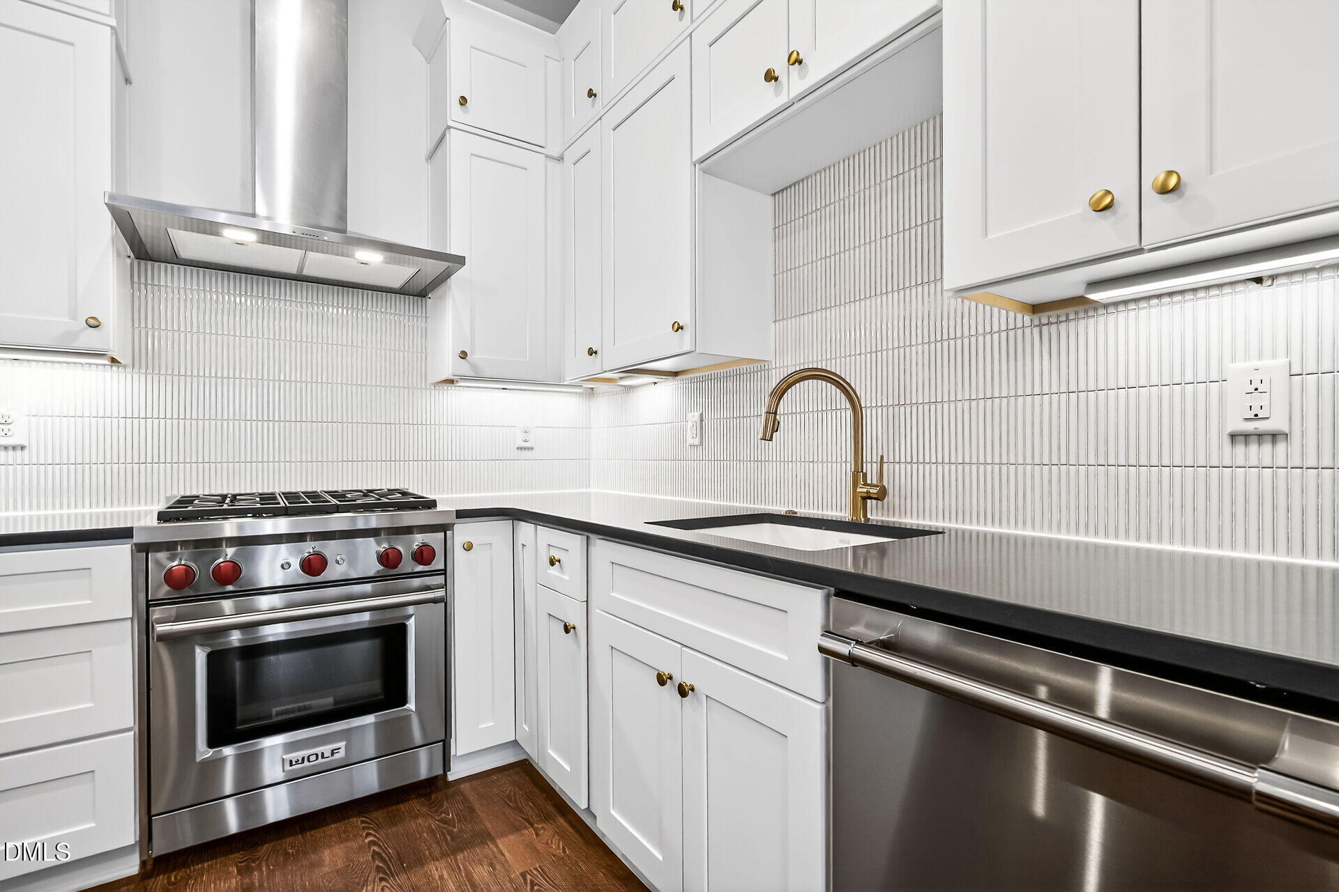 1521 1/2 Sunrise Avenue Raleigh, NC 27608 - Photo 20 of 37 a kitchen with a stove and a sink
