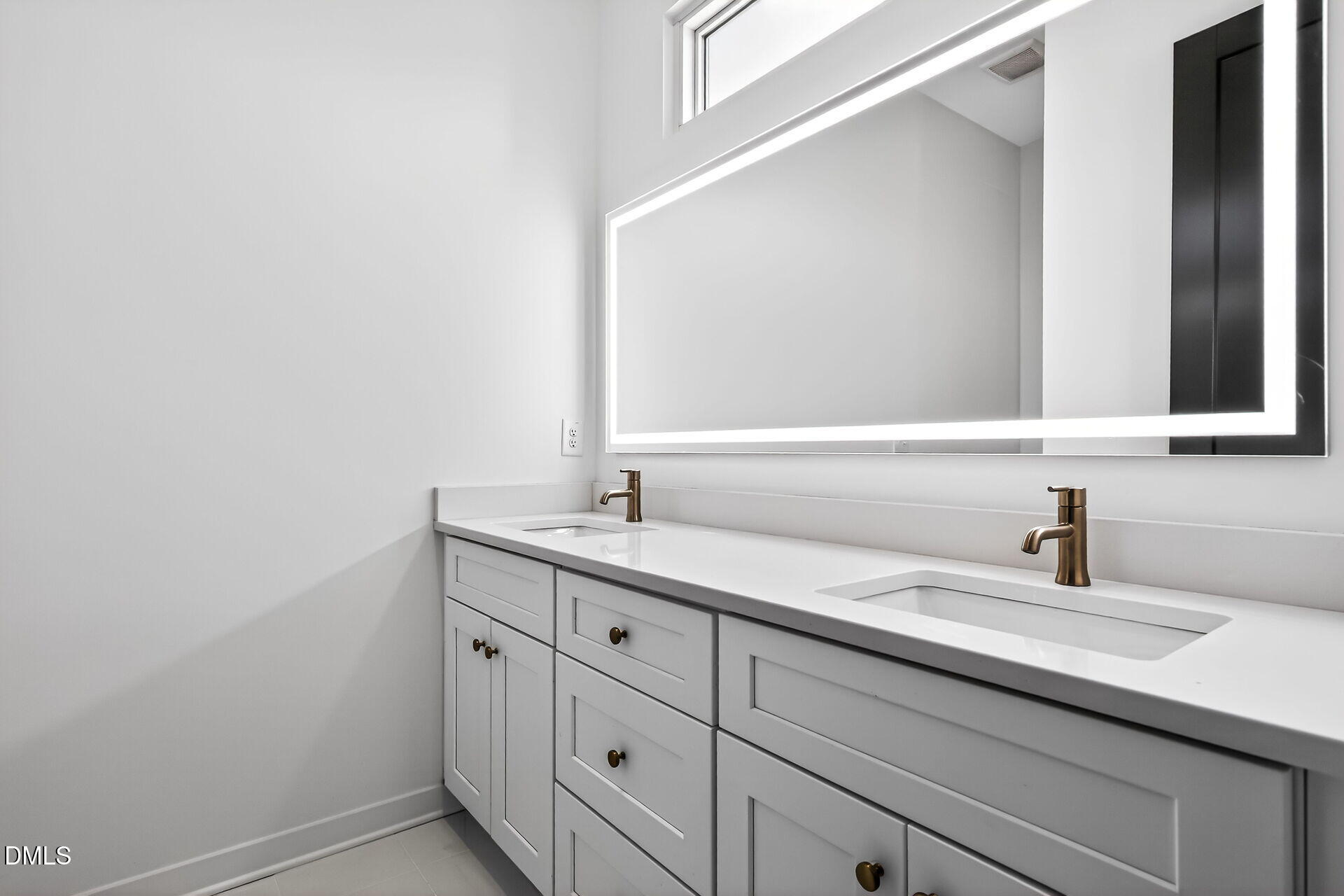 1521 1/2 Sunrise Avenue Raleigh, NC 27608 - Photo 24 of 37 a bathroom with a sink and a mirror