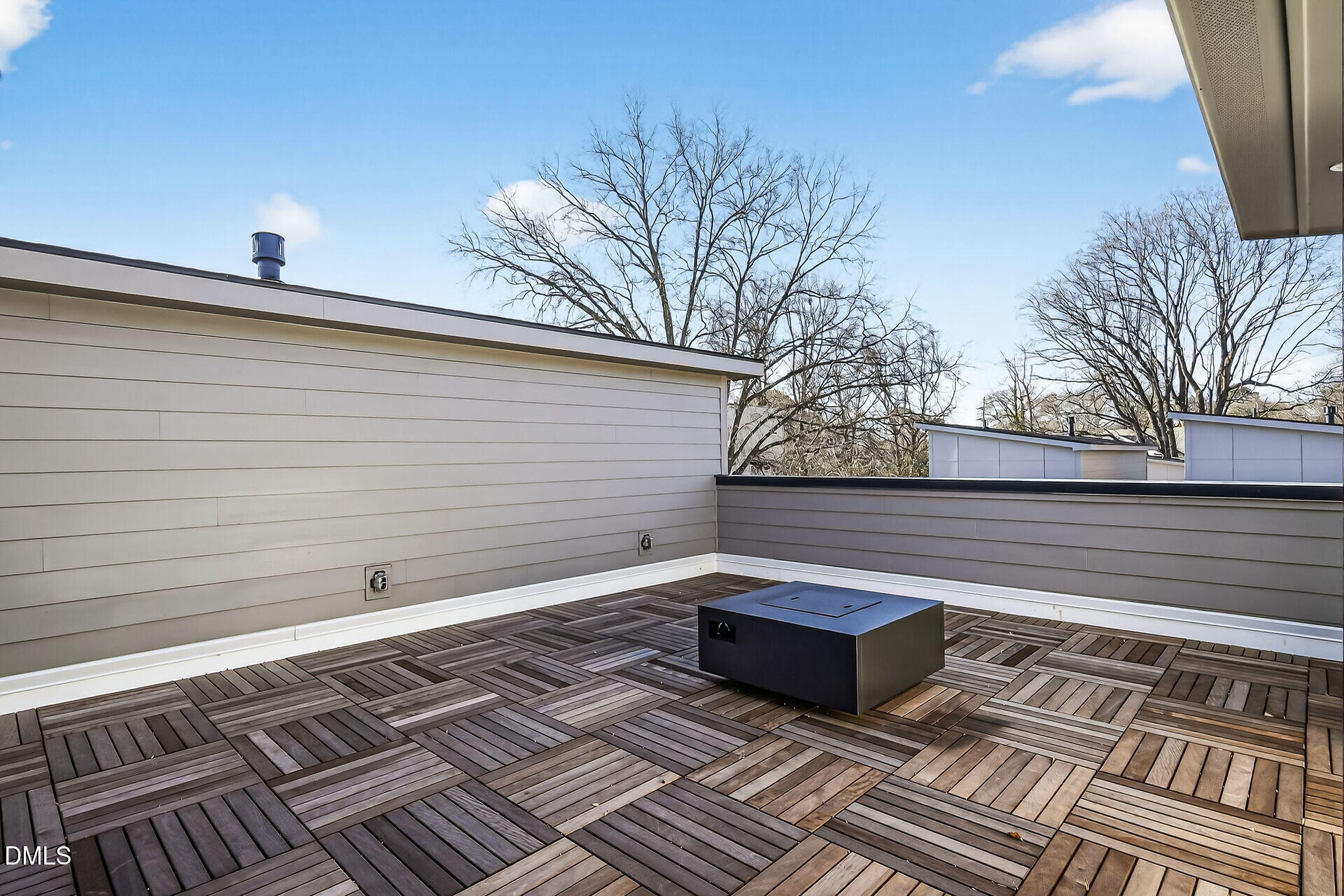 1521 1/2 Sunrise Avenue Raleigh, NC 27608 - Photo 28 of 37 a view of a roof deck with wooden floor and fence