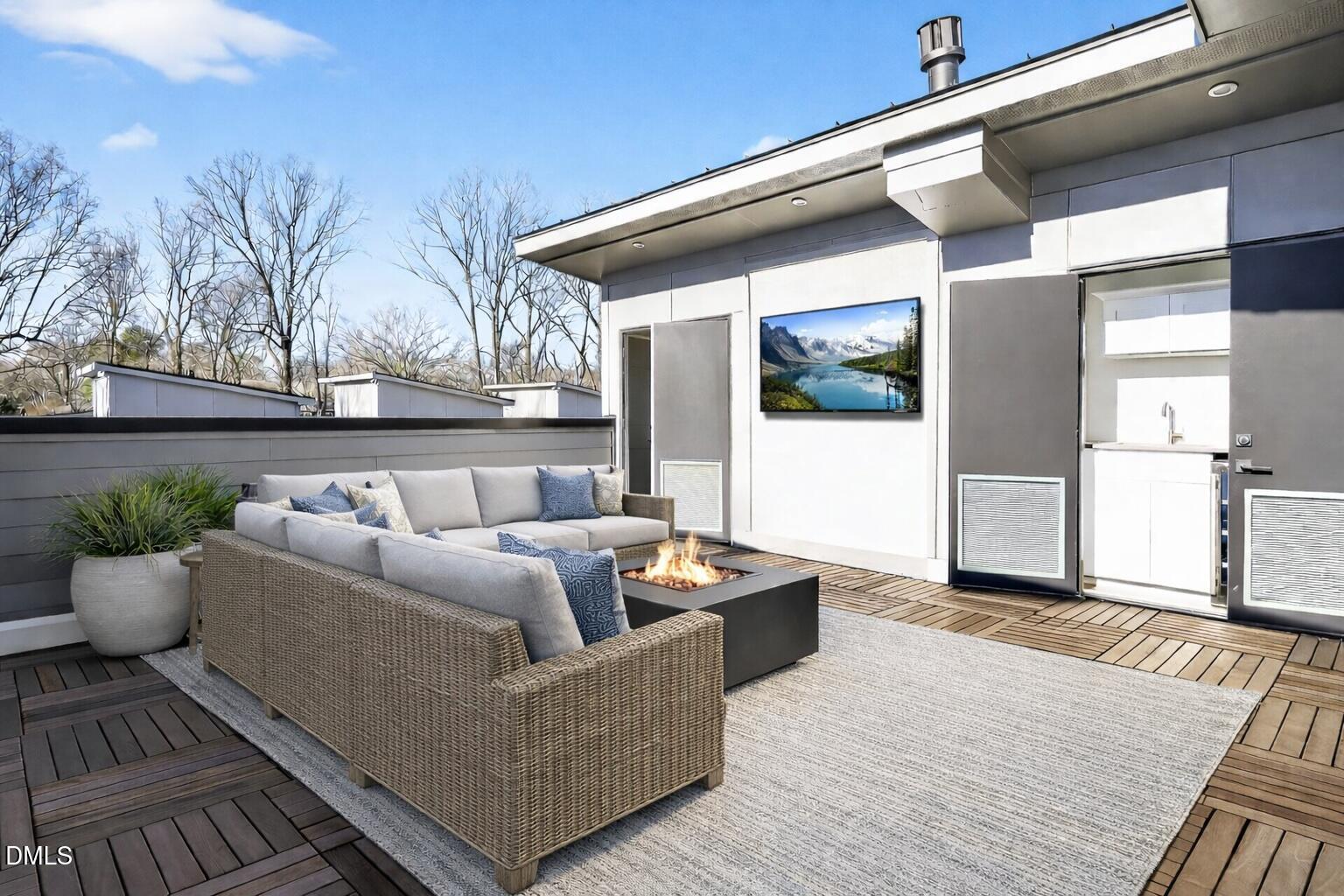 1521 1/2 Sunrise Avenue Raleigh, NC 27608 - Photo 29 of 37 a living room with furniture and a potted plant
