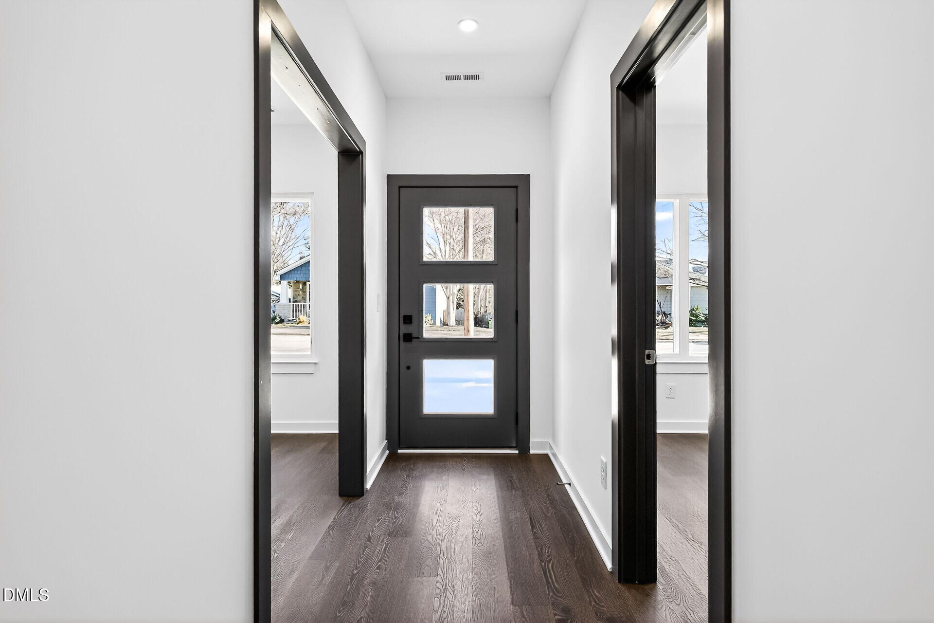 1521 1/2 Sunrise Avenue Raleigh, NC 27608 - Photo 4 of 37 a view of a hallway with wooden floor and entryway