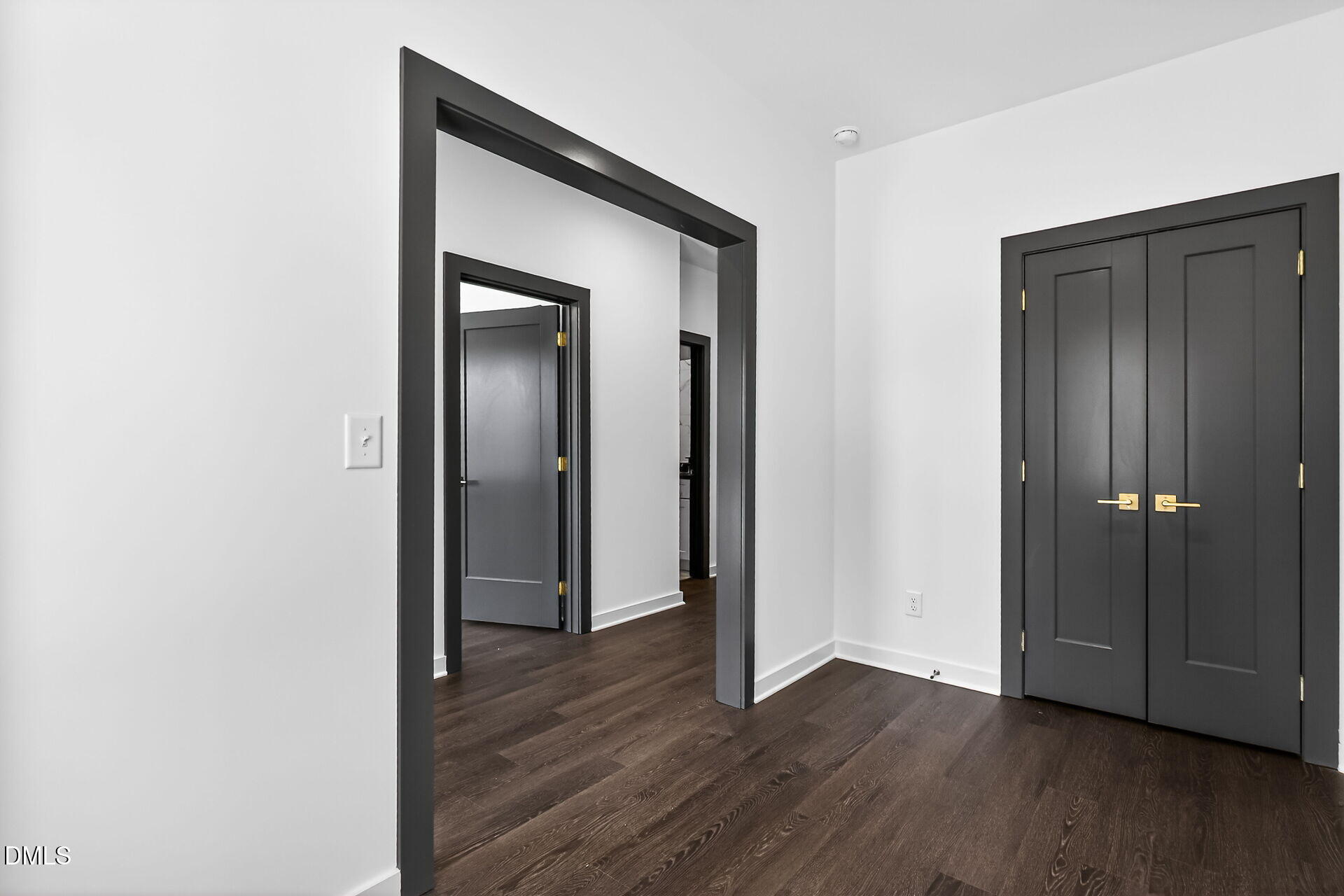 1521 1/2 Sunrise Avenue Raleigh, NC 27608 - Photo 7 of 37 a view of a hallway with wooden floor