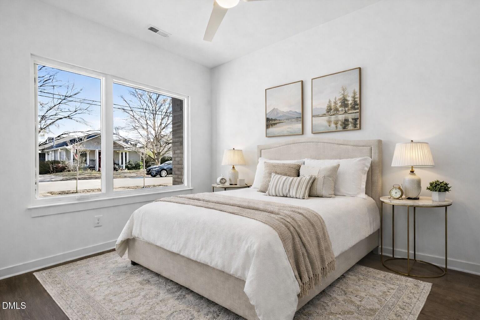 1521 1/2 Sunrise Avenue Raleigh, NC 27608 - Photo 8 of 37 a bedroom with a large bed and a window