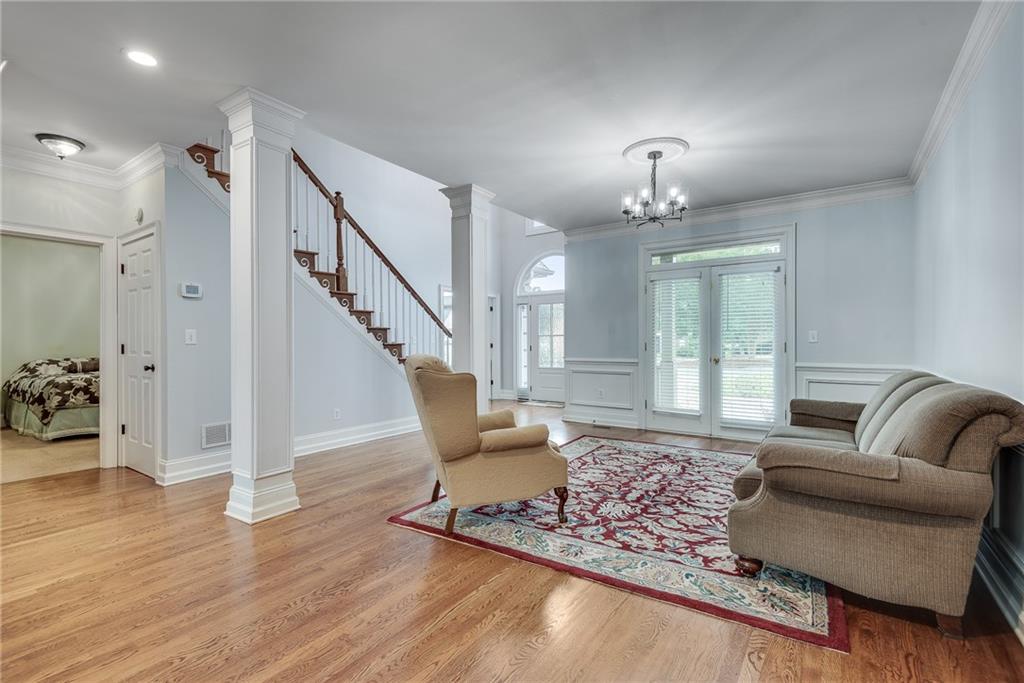 3969 Walkers Ridge Court Dacula, GA 30019 - Photo 11 of 60 a living room with furniture and wooden floor