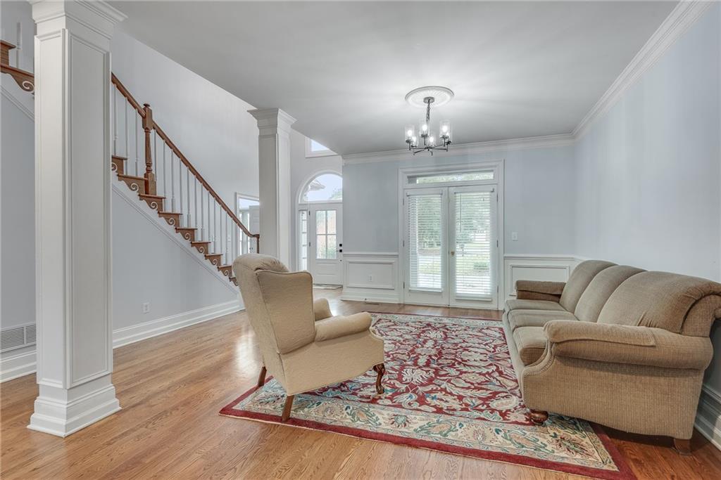 3969 Walkers Ridge Court Dacula, GA 30019 - Photo 12 of 60 a living room with furniture and a chandelier