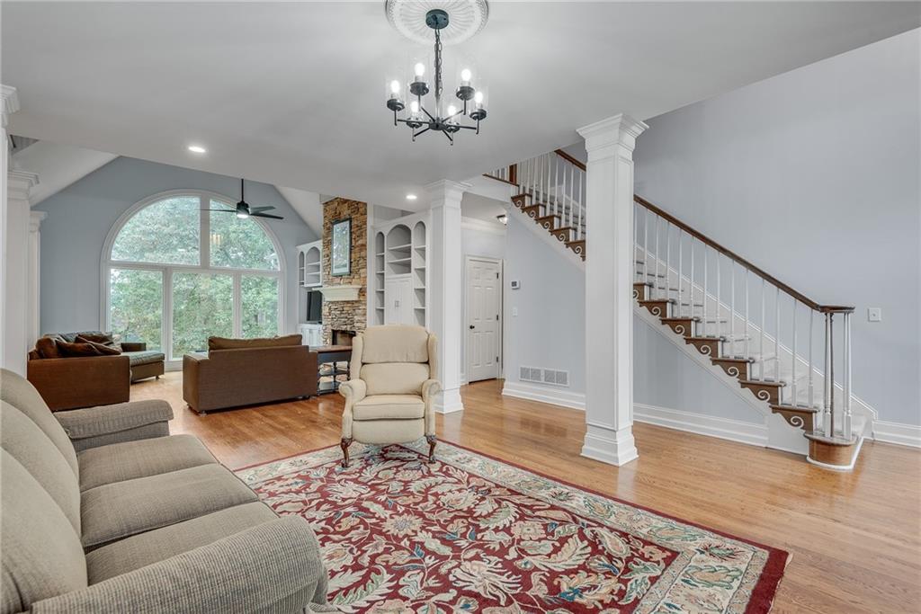 3969 Walkers Ridge Court Dacula, GA 30019 - Photo 13 of 60 a living room with furniture and a chandelier