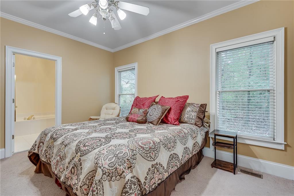 3969 Walkers Ridge Court Dacula, GA 30019 - Photo 31 of 60 a bedroom with a bed and a window