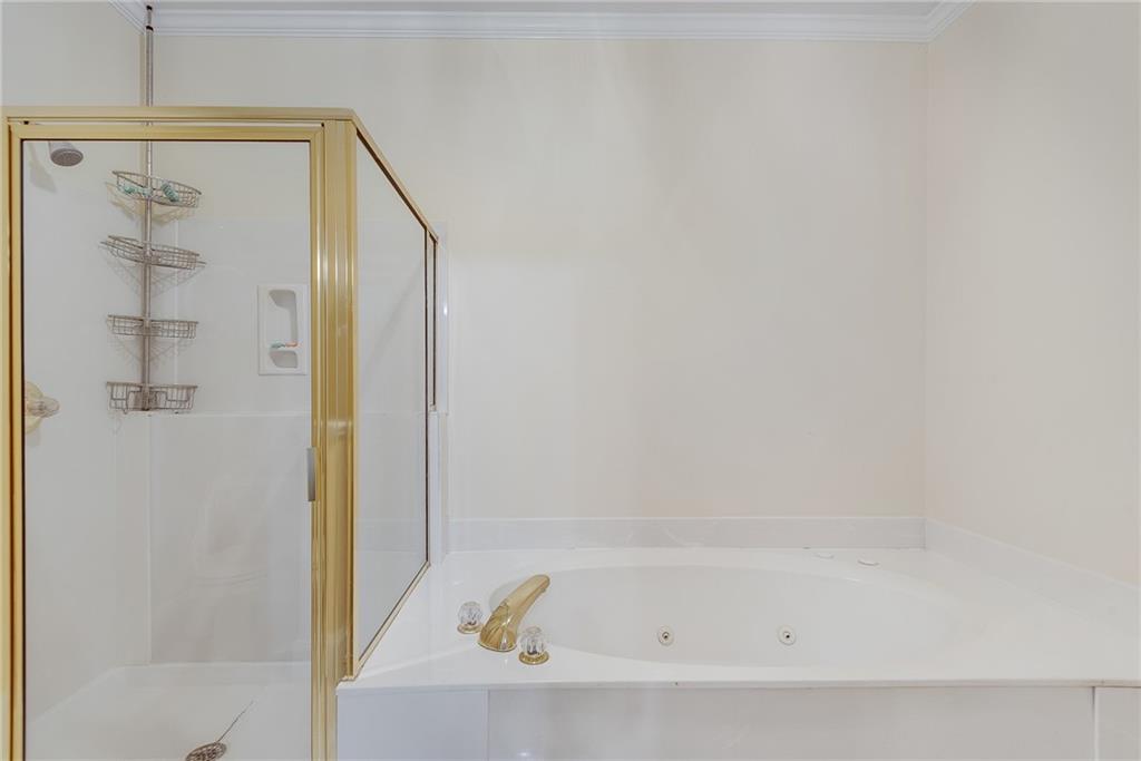 3969 Walkers Ridge Court Dacula, GA 30019 - Photo 33 of 60 a bathroom with a bathtub