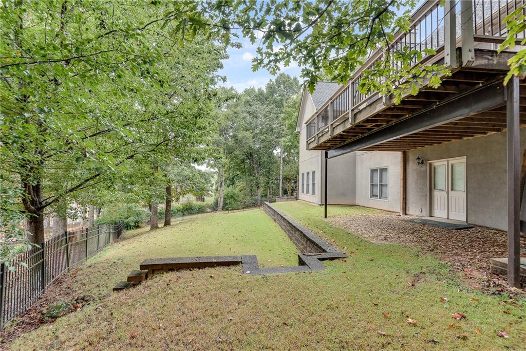 3969 Walkers Ridge Court Dacula, GA 30019 - Photo 54 of 60 a backyard of a house with lots of green space